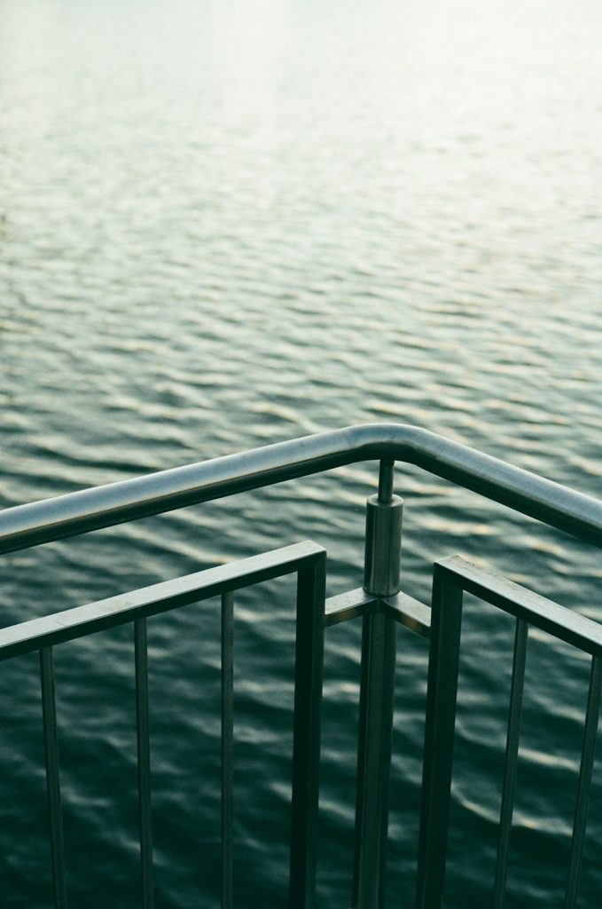 Mastering the First Impression: Your intriguing post title goes here a-view-of-a-body-of-water-from-a-railing-415zao2daww